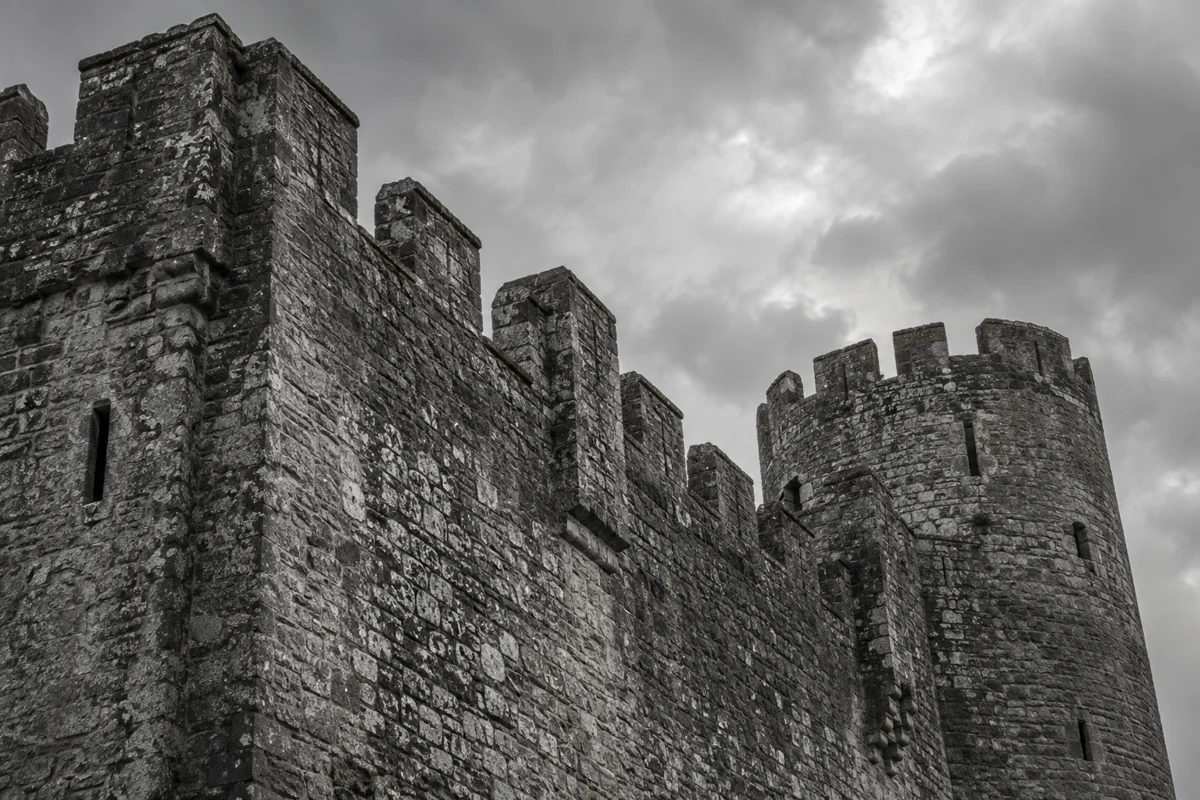 Weathered stone battlements of a Welsh-style castle